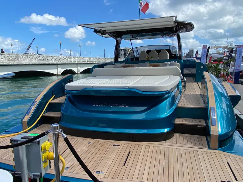 Slide: The Image of 2024 Solaris Power 52 Open luxury yacht docked at marina with bridge in background. - 6