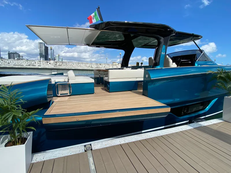 Slide: The Image of 2024 Solaris Power 52 Open luxury yacht docked, featuring sleek design and spacious deck. - 8