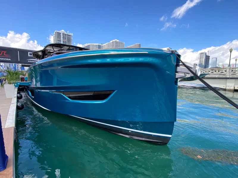 Slide: The Image of 2024 Solaris Power 52 Open luxury yacht docked in a marina. - 9