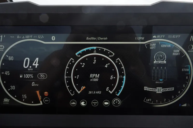 Slide: The Image of Dashboard of 2023 Malibu Wakesetter 23 LSV showing speed, RPM, and surf settings. - 10