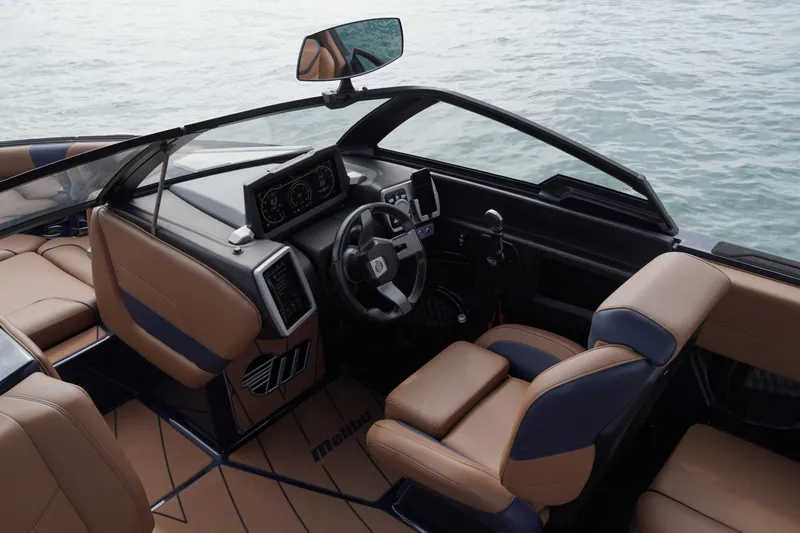 Slide: The Image of 2023 Malibu Wakesetter 23 LSV interior with modern dashboard and luxurious seating. - 2