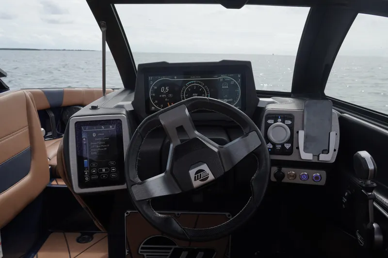 Slide: The Image of 2023 Malibu Wakesetter 23 LSV dashboard with advanced controls and navigation display. - 9