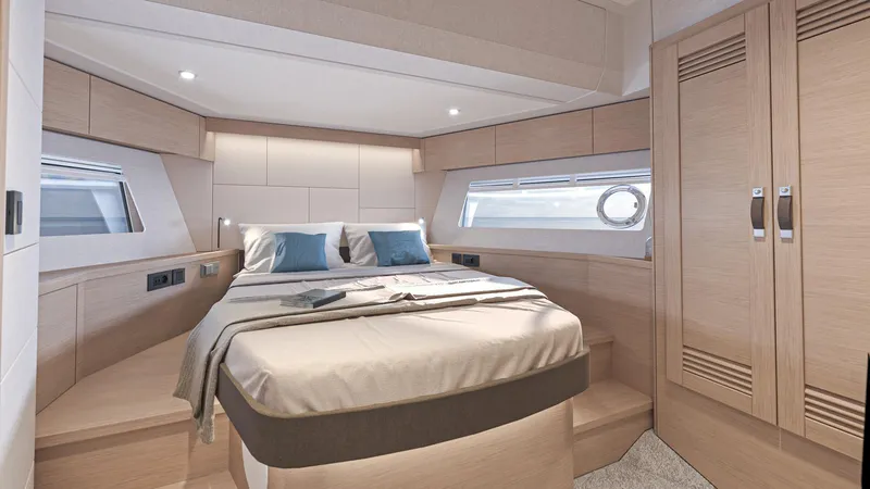 Slide: The Image of Luxurious bedroom in 2025 Beneteau Swift Trawler 54 yacht, featuring modern design and cozy ambiance. - 21