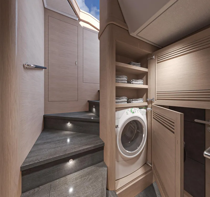 Slide: The Image of Laundry area in 2025 Beneteau Swift Trawler 54, featuring washer and storage shelves. - 23