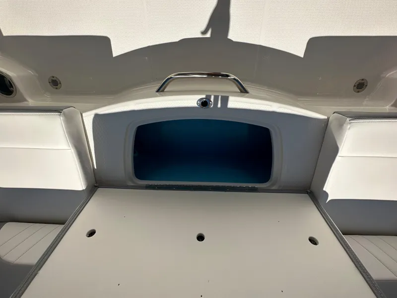 Slide: The Image of 2024 Chaparral 21 SSi OB boat interior storage compartment. - 29