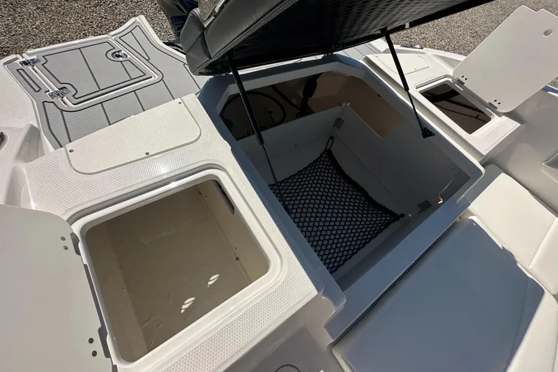 Slide: The Image of 2024 Chaparral 21 SSi OB boat storage compartments and seating area. - 38
