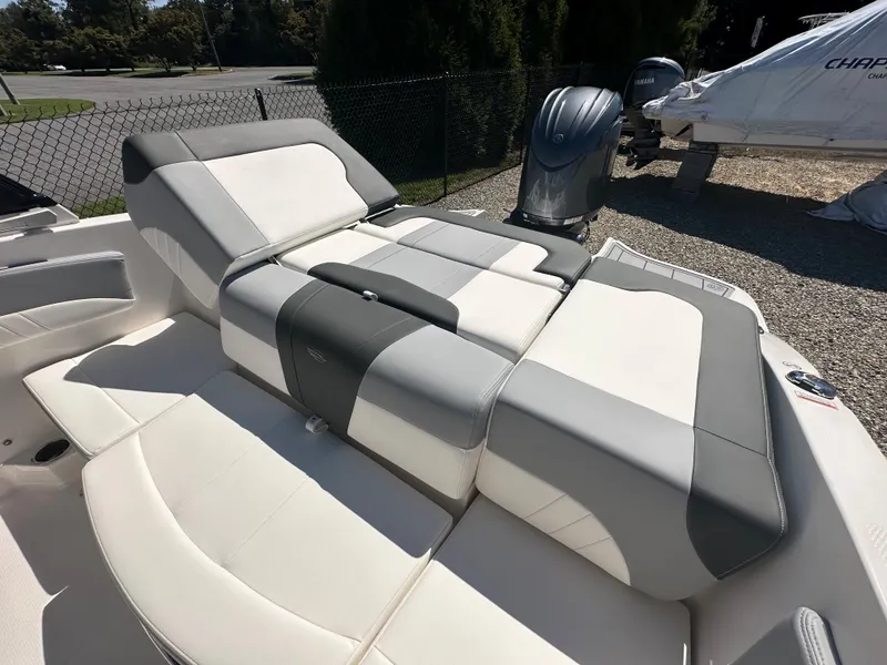 Slide: The Image of 2024 Chaparral 21 SSi OB boat with luxurious seating and outboard motor. - 41