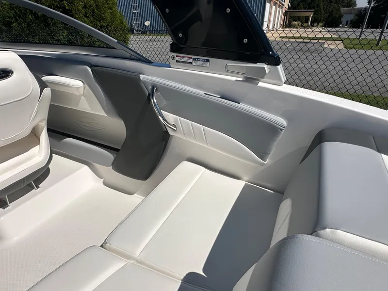 Slide: The Image of Interior of 2024 Chaparral 21 SSi OB boat with white and gray seating. - 48
