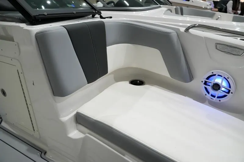 Slide: The Image of 2025 Chaparral 21 SSi boat interior with cushioned seating and illuminated speaker. - 8