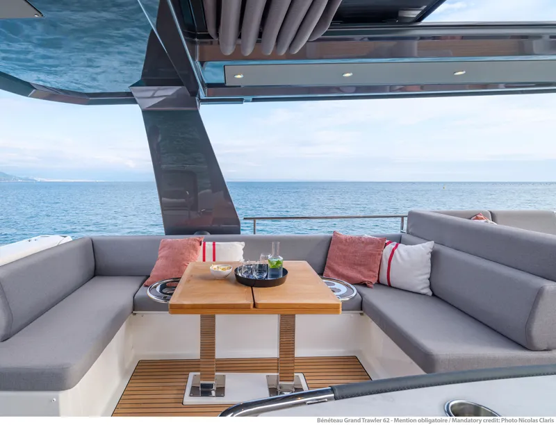 Slide: The Image of Luxurious seating area on 2025 Beneteau Grand Trawler 62 yacht with ocean view. - 15