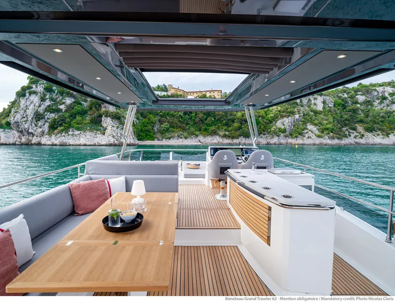 Slide: The Image of Luxurious 2025 Beneteau Grand Trawler 62 yacht interior with scenic ocean view. - 17