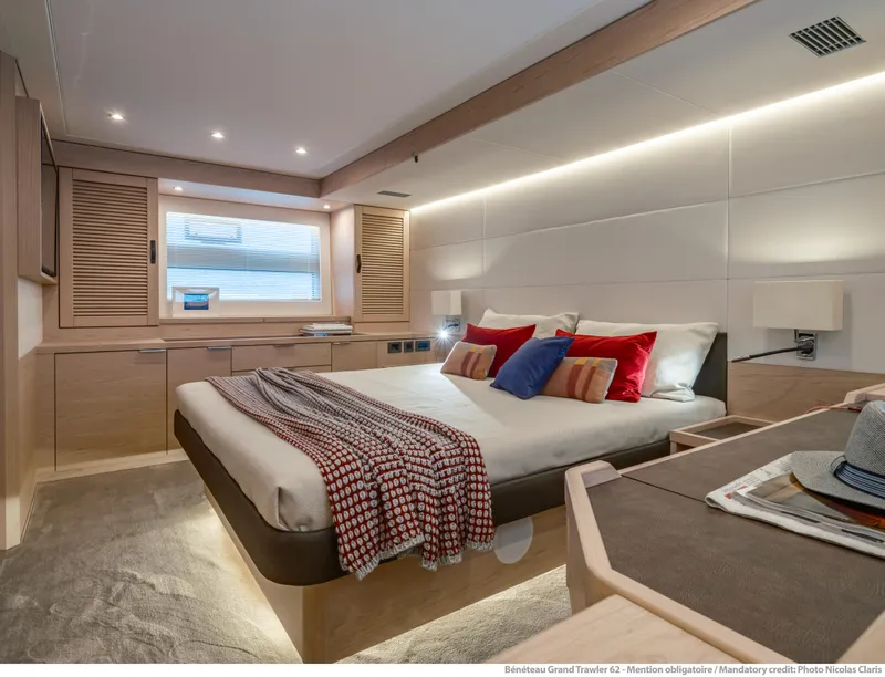 Slide: The Image of Luxurious bedroom interior of 2025 Beneteau Grand Trawler 62 yacht, featuring modern design and cozy decor. - 23