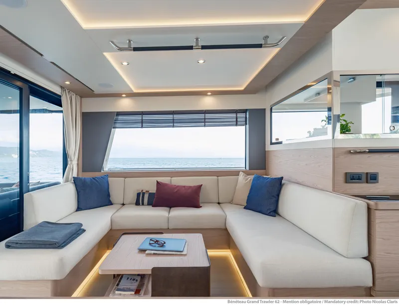 Slide: The Image of Luxurious interior of 2025 Beneteau Grand Trawler 62 with elegant seating and sea view. - 30