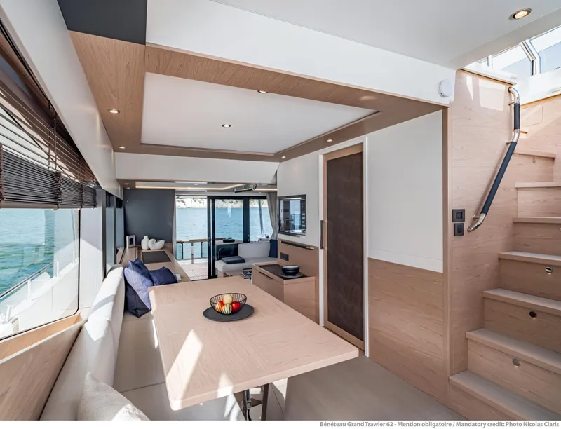 Slide: The Image of Interior of 2025 Beneteau Grand Trawler 62, featuring modern design and spacious seating area. - 32