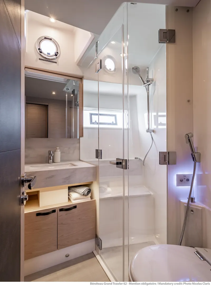 Slide: The Image of Luxurious bathroom in 2025 Beneteau Grand Trawler 62 yacht with modern fixtures. - 33