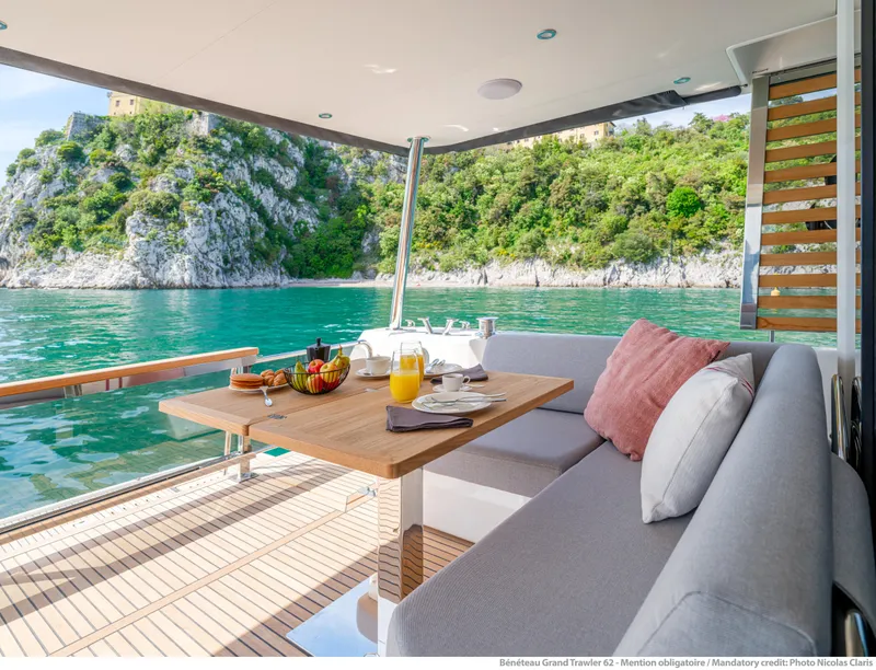 Slide: The Image of Luxurious Beneteau Grand Trawler 62 yacht interior with scenic ocean view, 2025 model. - 8