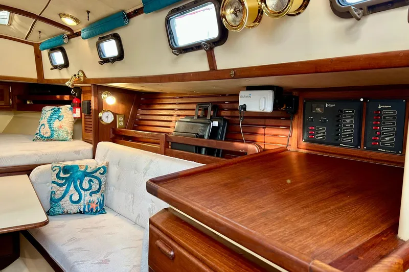Slide: The Image of 1994 Pacific Seacraft 31 interior with nautical decor and control panels. - 15