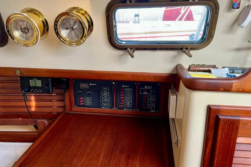Slide: The Image of Interior of 1994 Pacific Seacraft 31 sailboat with navigation instruments and control panels. - 16