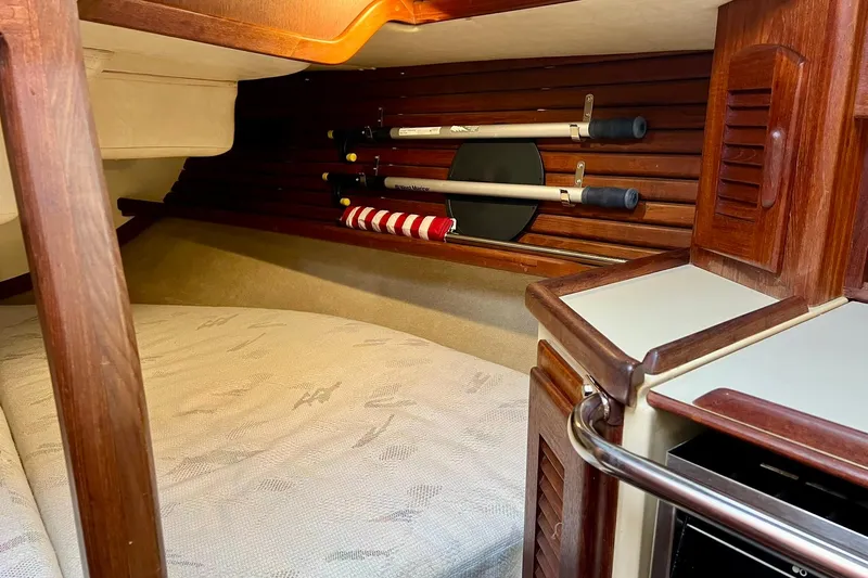 Slide: The Image of Cozy cabin interior of 1994 Pacific Seacraft 31 sailboat with wooden accents. - 23