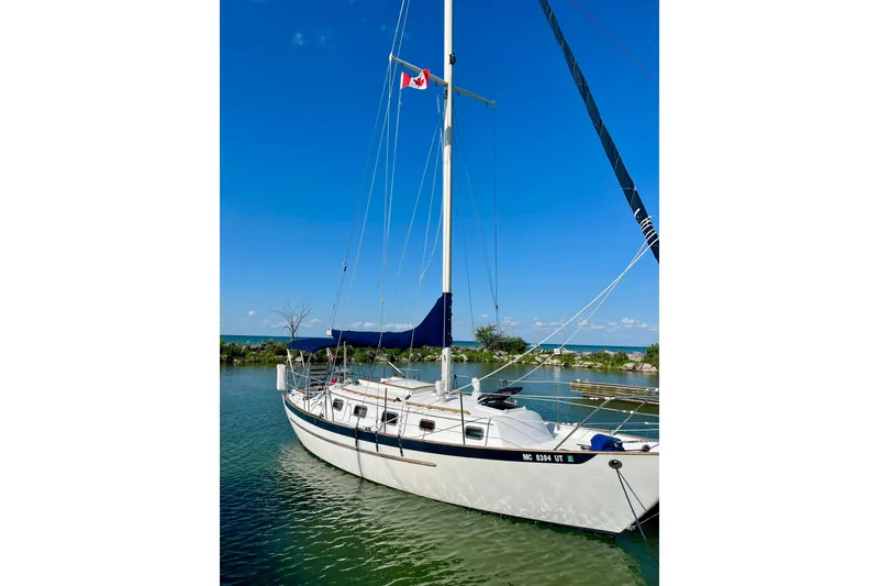 Slide: The Image of Sailboat Pacific Seacraft 31, 1994 model, docked on a sunny day with clear blue skies. - 3