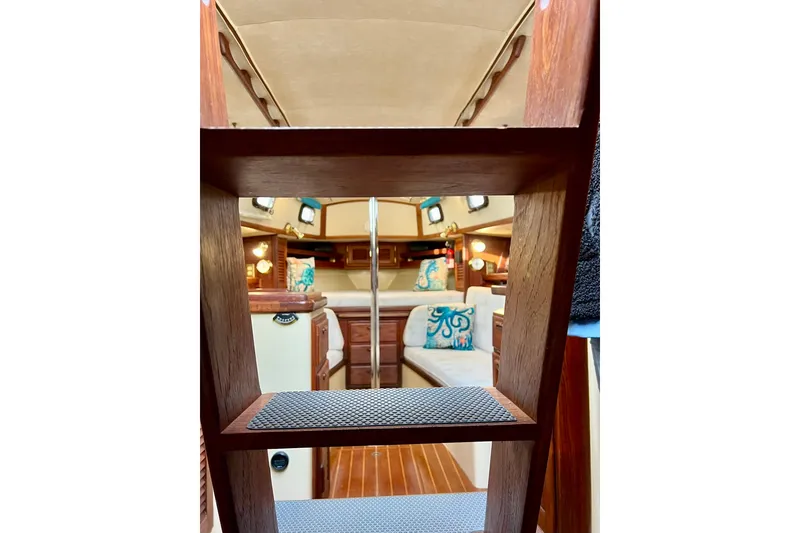 Slide: The Image of Interior view of 1994 Pacific Seacraft 31 sailboat, featuring cozy cabin and wooden accents. - 40