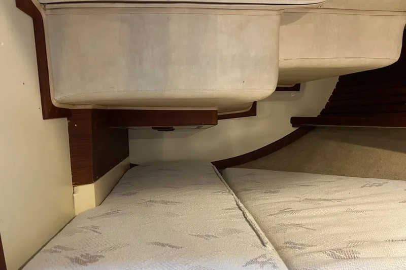 Slide: The Image of Interior cabin view of a 1994 Pacific Seacraft 31 sailboat, featuring cushioned seating. - 43