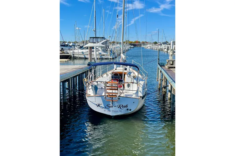 Slide: The Image of 1994 Pacific Seacraft 31 sailboat docked in marina under clear blue sky. - 5