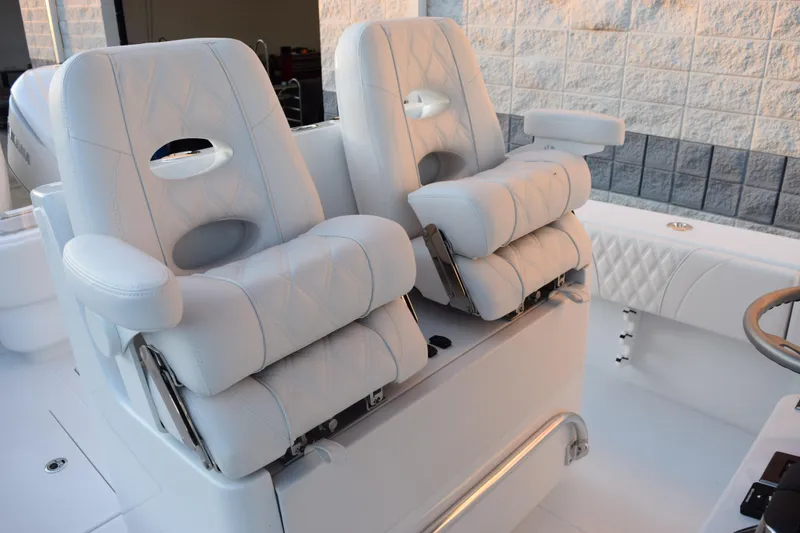 Slide: The Image of Luxurious seating on 2026 Contender 32 ST boat, featuring plush white upholstery and modern design. - 11