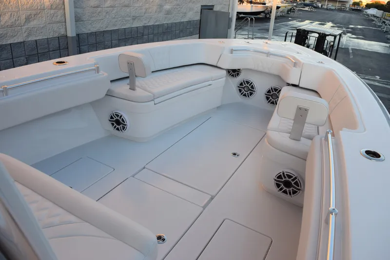 Slide: The Image of 2026 Contender 32 ST boat interior with white seating and built-in speakers. - 12