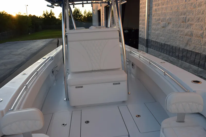 Slide: The Image of 2026 Contender 32 ST boat interior with white seating and sleek design. - 13
