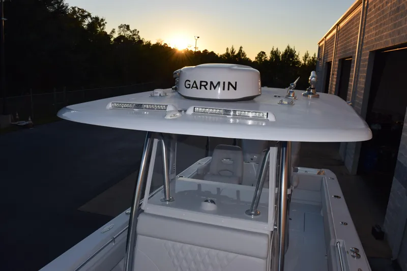 Slide: The Image of 2026 Contender 32 ST boat with Garmin equipment at sunset. - 15