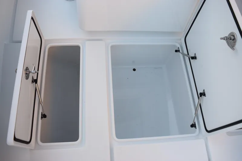 Slide: The Image of Open storage compartments on a 2026 Contender 32 ST boat. - 21