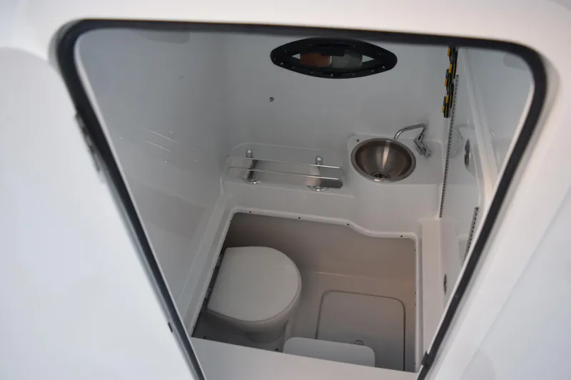 Slide: The Image of 2026 Contender 32 ST boat interior bathroom with sink and toilet. - 23
