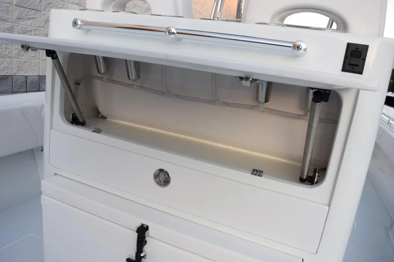 Slide: The Image of Open storage compartment on 2026 Contender 32 ST boat, showcasing interior features. - 28