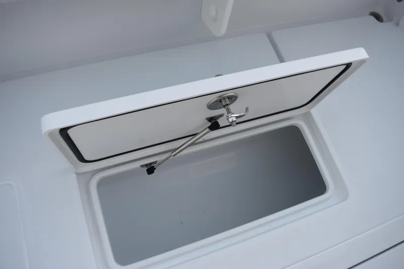 Slide: The Image of Open storage compartment on 2026 Contender 32 ST boat. - 33