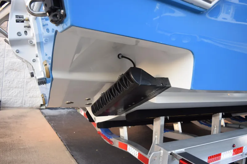 Slide: The Image of 2026 Contender 32 ST boat on trailer, showcasing hull and transom details. - 7