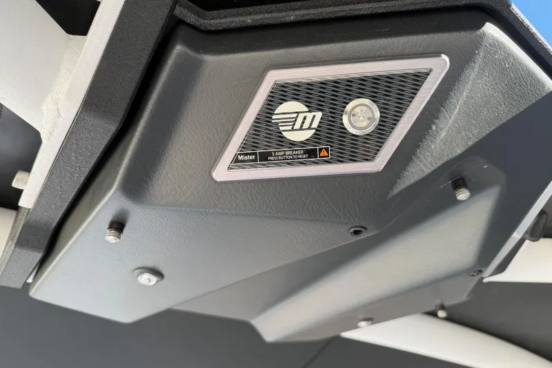 Slide: The Image of 2023 Malibu M240 boat component with logo and circuit breaker detail. - 34