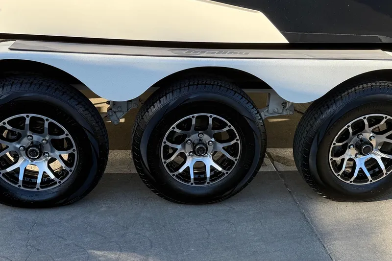 Slide: The Image of 2023 Malibu M240 trailer with sleek alloy wheels, showcasing modern design and durability. - 36