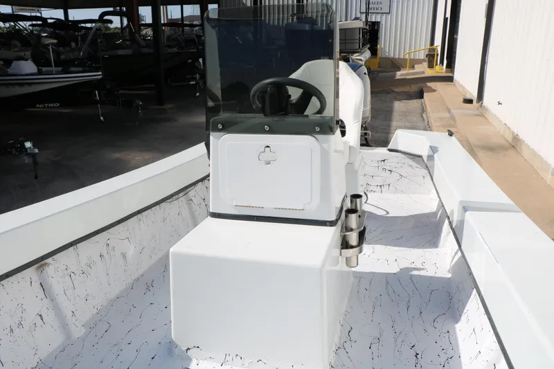 Slide: The Image of 2018 Mr. B's Boats 16 Skiff interior with steering console and rod holders. - 11