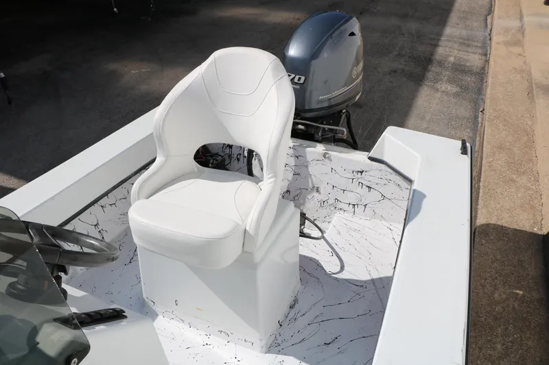 Slide: The Image of 2018 Mr. B's Boats 16 Skiff with white seating and Yamaha outboard motor. - 12