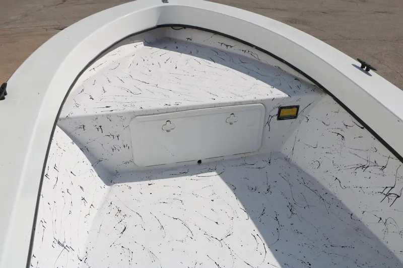 Slide: The Image of 2018 Mr. B's Boats 16 Skiff interior with speckled design and storage compartment. - 14