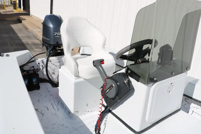 Slide: The Image of 2018 Mr. B's Boats 16 Skiff with Yamaha 70 engine and steering console. - 16