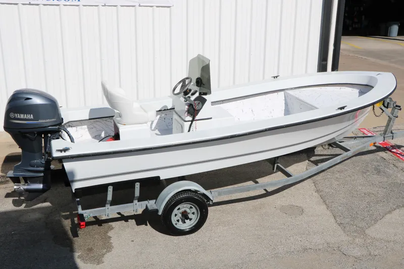 Slide: The Image of 2018 Mr. B's Boats 16 Skiff on trailer with Yamaha outboard motor. - 19