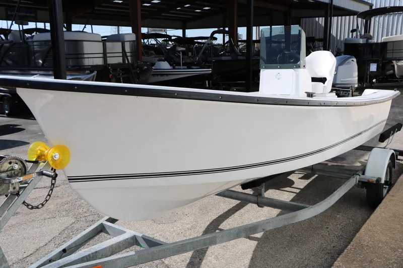 Slide: The Image of 2018 Mr. B's Boats 16 Skiff on trailer, white hull, outdoor display. - 7
