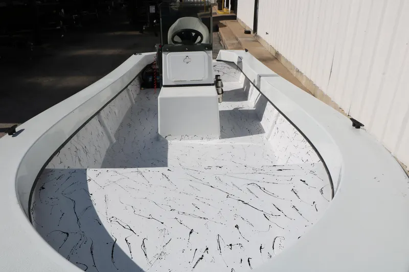 Slide: The Image of 2018 Mr. B's Boats 16 Skiff with speckled interior design, docked outdoors. - 8