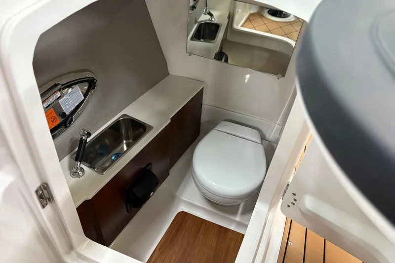 Slide: The Image of 2026 Chaparral 30 SSX boat interior bathroom with sink and toilet. - 12