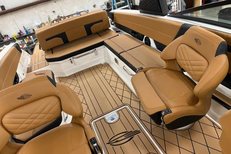 Slide: The Image of Luxurious interior of 2026 Chaparral 30 SSX boat with tan leather seating. - 15