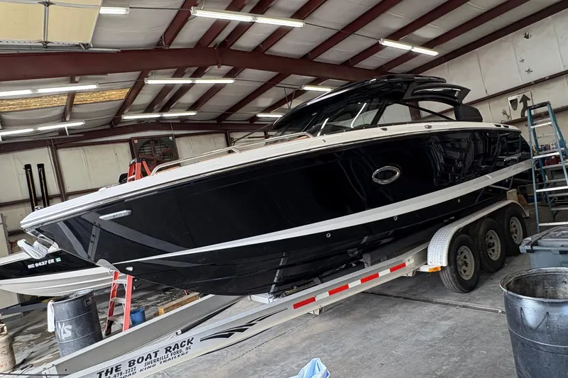 Slide: The Image of 2026 Chaparral 30 SSX boat on trailer in indoor storage facility. - 20