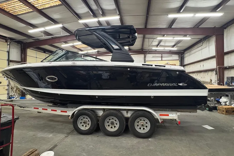 Slide: The Image of 2026 Chaparral 30 SSX boat on trailer in warehouse setting. - 3