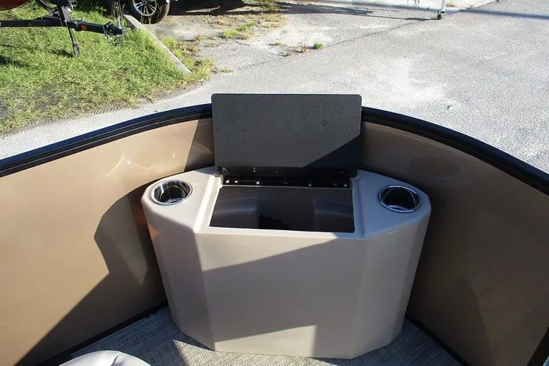 Slide: The Image of 2026 Bentley Pontoons Fish 200 4-Point interior with cup holders and storage compartment. - 11